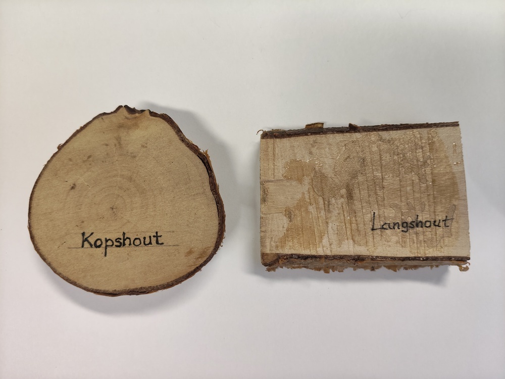 2 stukken hout. Kopshout en langshout.