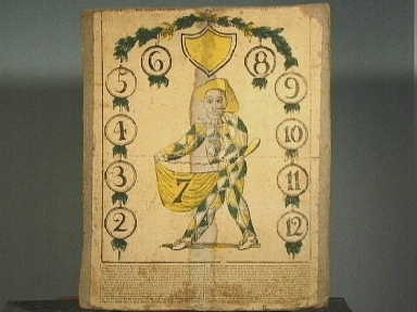 Kartonnen harlekijn spel in doos.