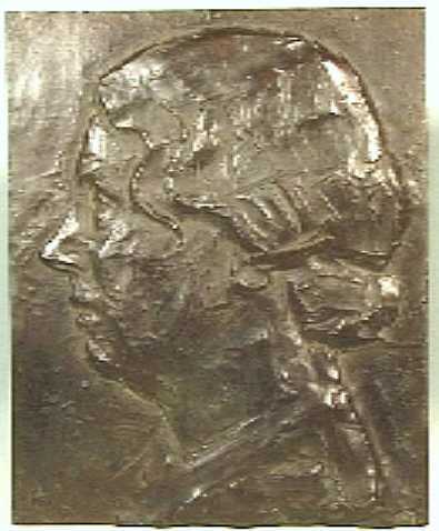 Koperen plaat met daarin gedreven een portret van Juliana, hoofd en profil gewend naar links.