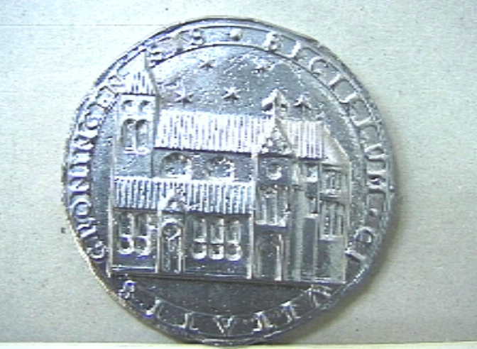 Afdruk van een zilveren zegel met centraal de Martinikerk te Groningen.