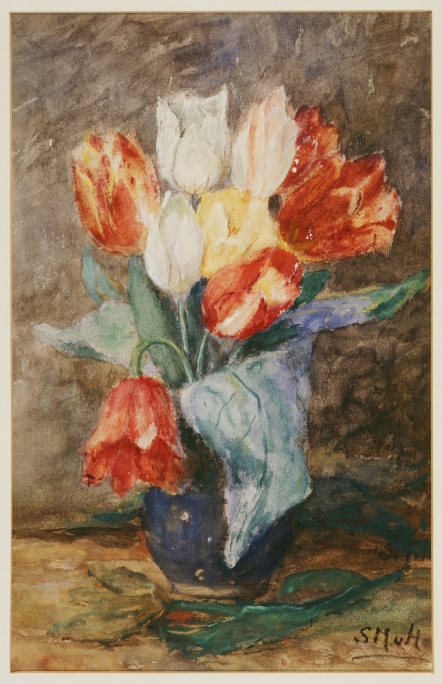 Tulpen in blauwe vaas.