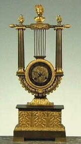 Metalen goudkleurig harpklokje.