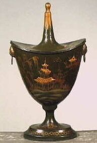 Beschilderde blikken kastanjevaas met deksel.