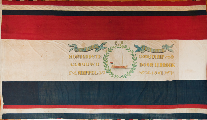 Feestvlag 'Koophandel en Zeevaart, Honderdste schip gebouwd door Hk. Broek Meppel 1861', door Herm Elbers