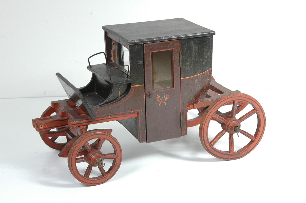 Schaalmodel van coupé met paard