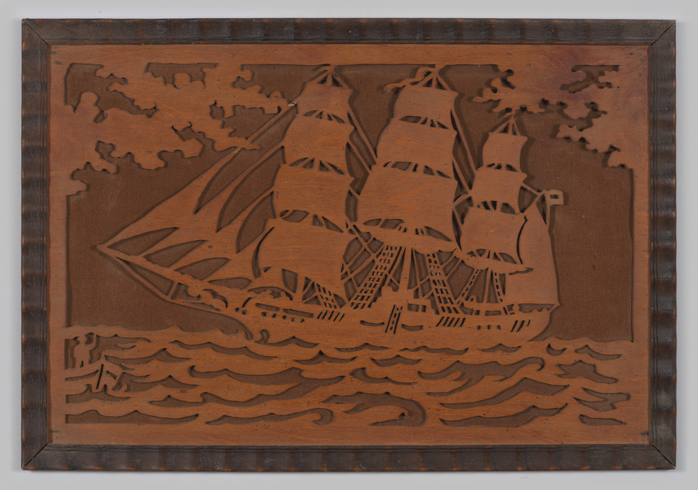 Driemaster op zee gemaakt in figuurzaagwerk