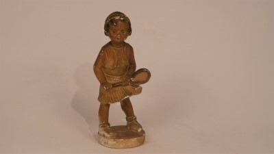 beeldje voorstellende tennisspeelster