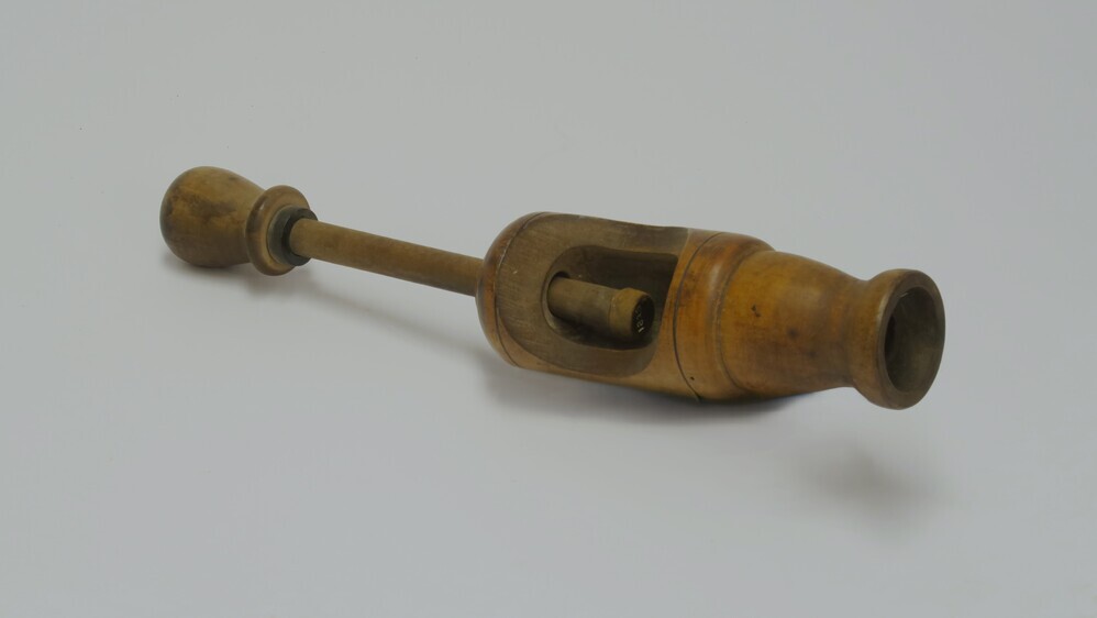 apparaat om kurken in flessen te drukken