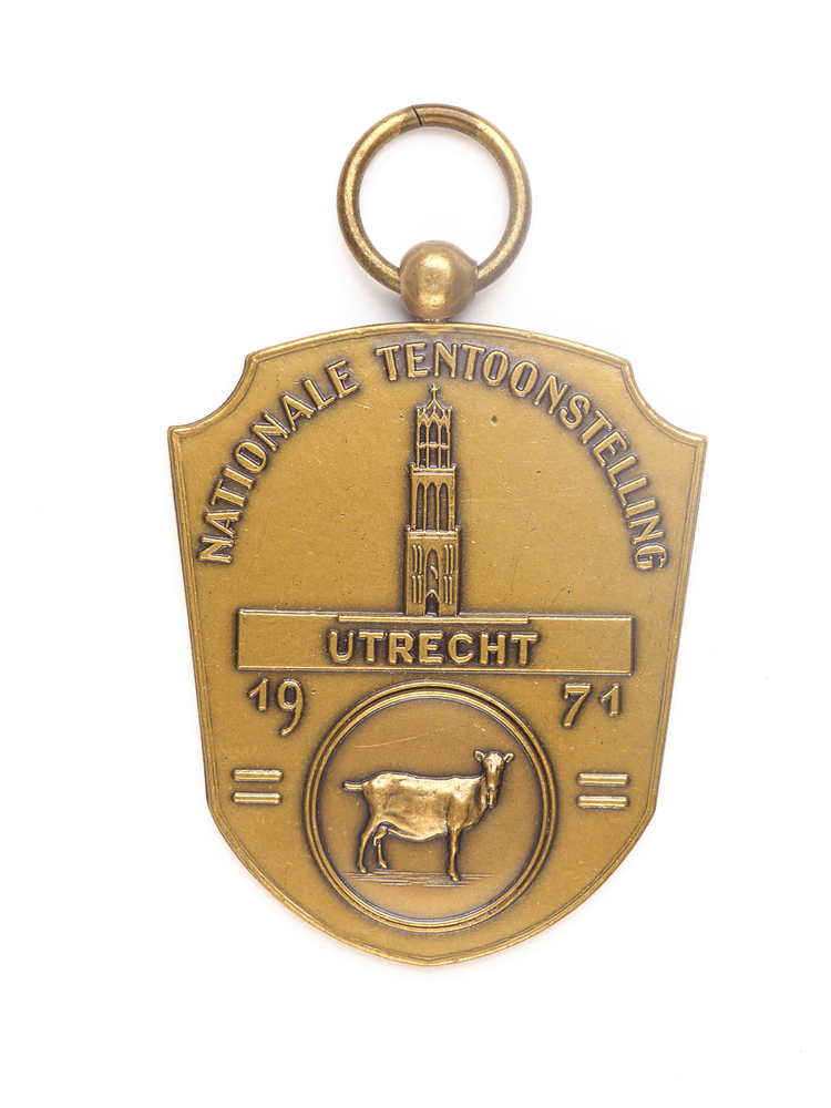 koperkleurige elipsvormige medaille met op voorkant afbeelding van een geit en een toren en de inscriptie Nationale tentoonstelling Utrecht 1971, aan achterkant inscriptie 1 G 398