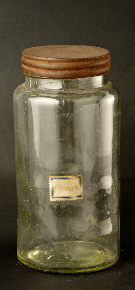 ronde glazen fles met metalen dop