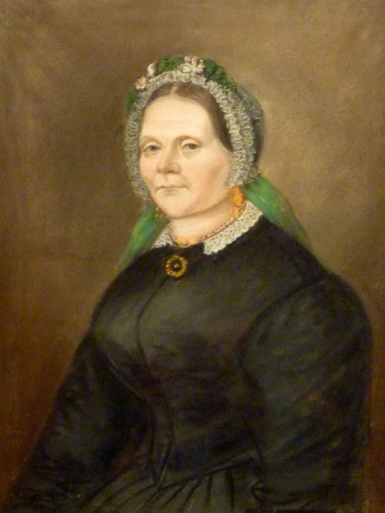 Pasteltekening van Hinderkien Blokbergen te halve lijve, en trois quart, vervaardigd in 1868 door Berend Kunst te Wisum-Obergum. Hinderkien Blokbergen ( geboren Veendam 21-07-1815, overleden 04-12-1873 te Veendam.Echtgenote van Doewe Jans Smidt (1816-1896 )