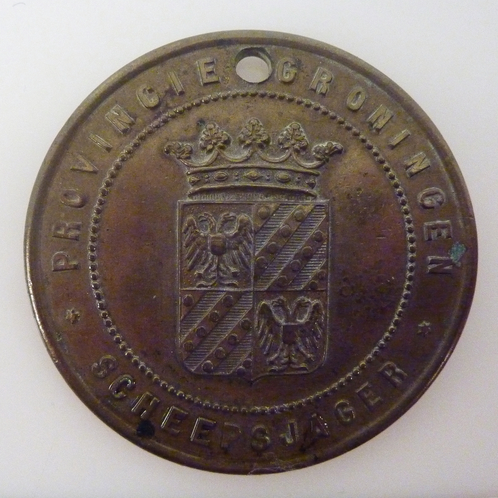 ronde messing scheepsjagerspenning met op voorkant randschrift Provincie Groningen Scheepsjager 270, afkomstig van Oldenburger