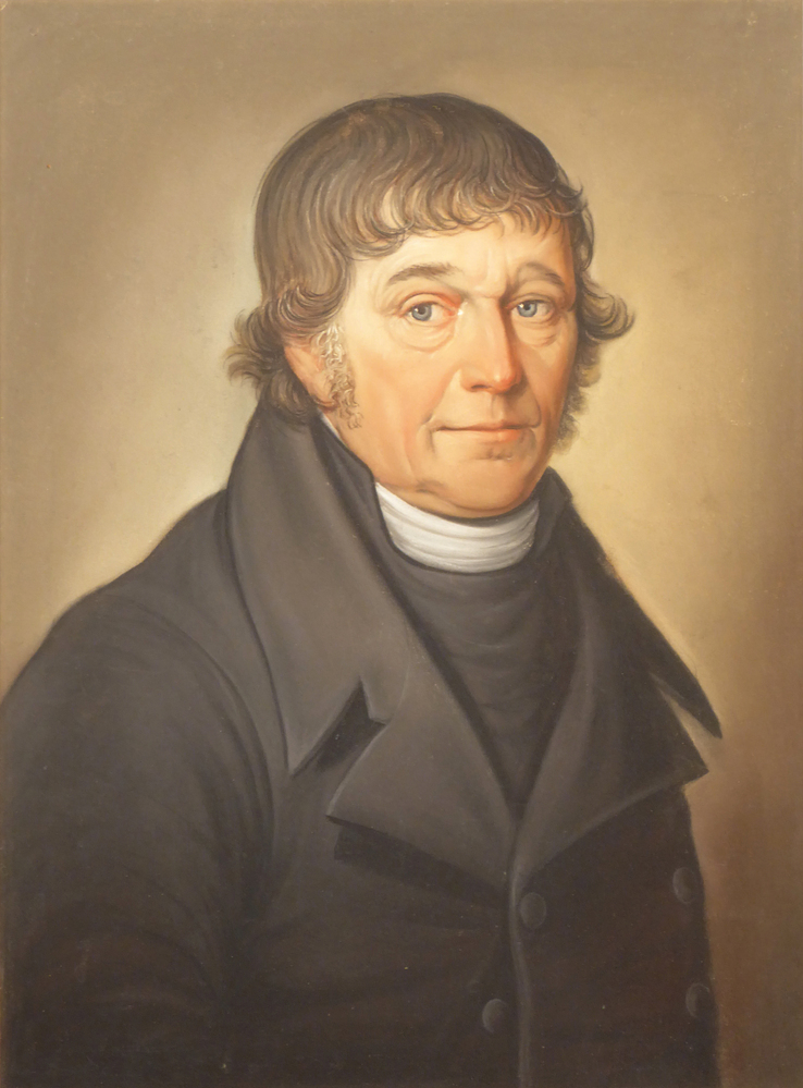 Pastel van een man met zwarte overjas met 4 knopen, bruin haar met grijze bakkebaarden, portret naar rechts, voorstellende Jan Jacobs Muis, geboren ongeveer 1762, overleden 26 oktober 1833 te Veendam, landbouwer, toegeschreven aan Berend Kunst, vervaardigd omstreeks 1823-1833
