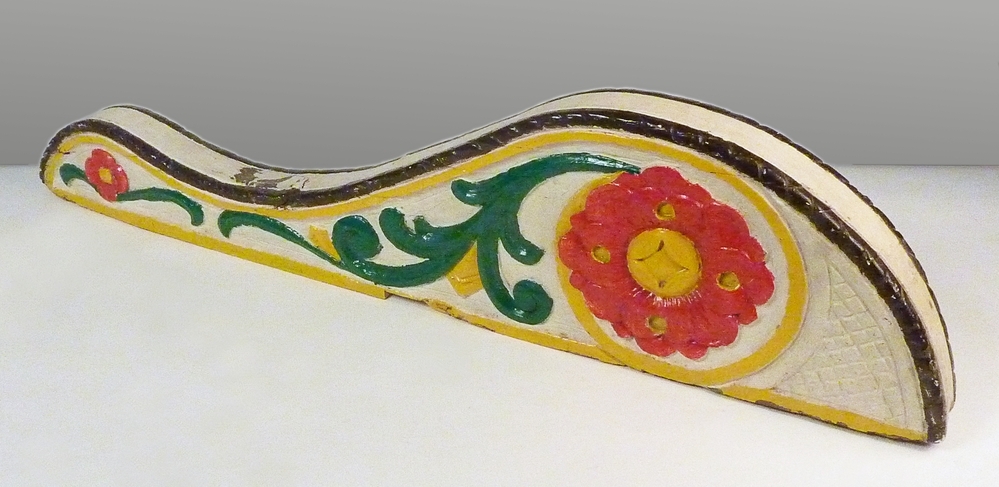 roerklik van de Deo Juvante van dhr. Jan Bellinga, wit met rood, geel en groen en afbeelding van een bloem.