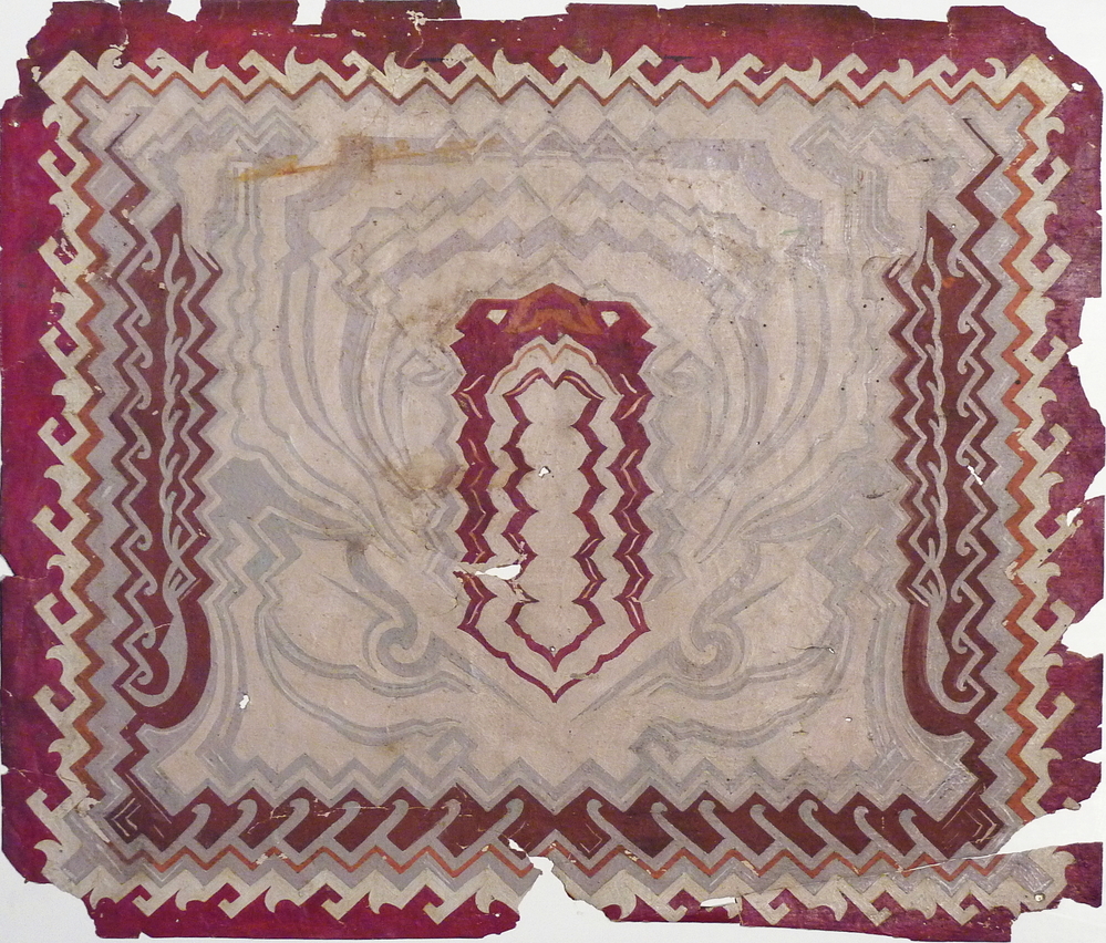 kartonnen plaat met rood, grijs en witte afbeelding van een zigzaglijn