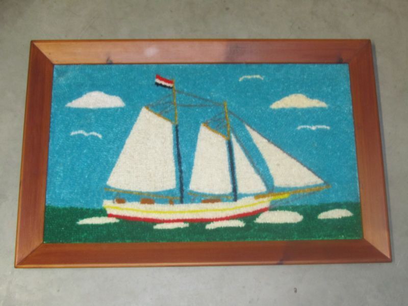 ingelijste spekmat met afbeelding zeilschip